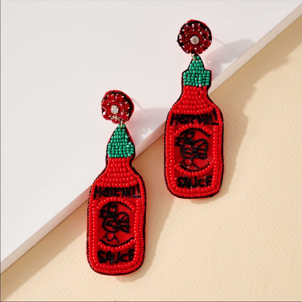 Hot Sauce dangling earrings.